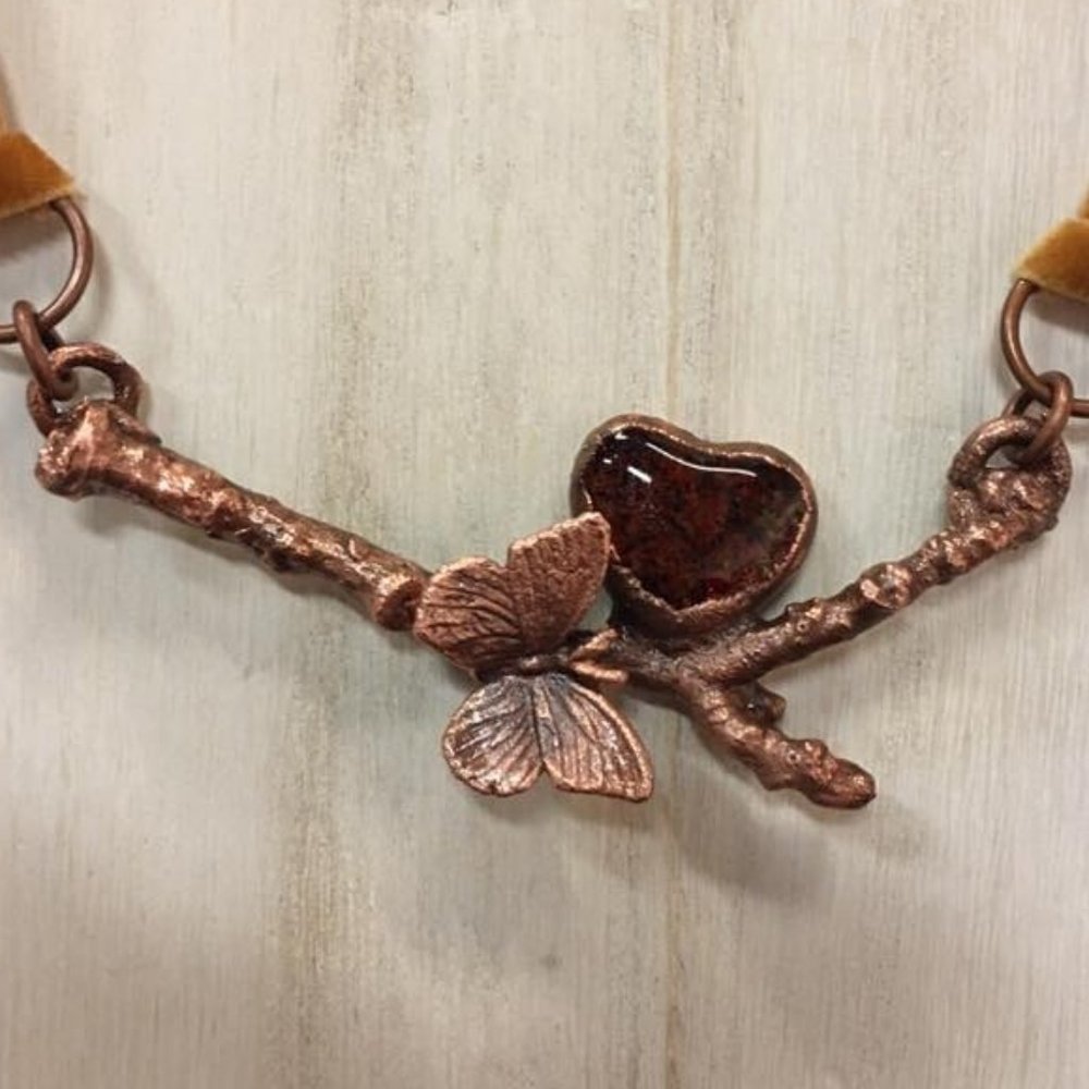 Butterfly, heart and twig pendant